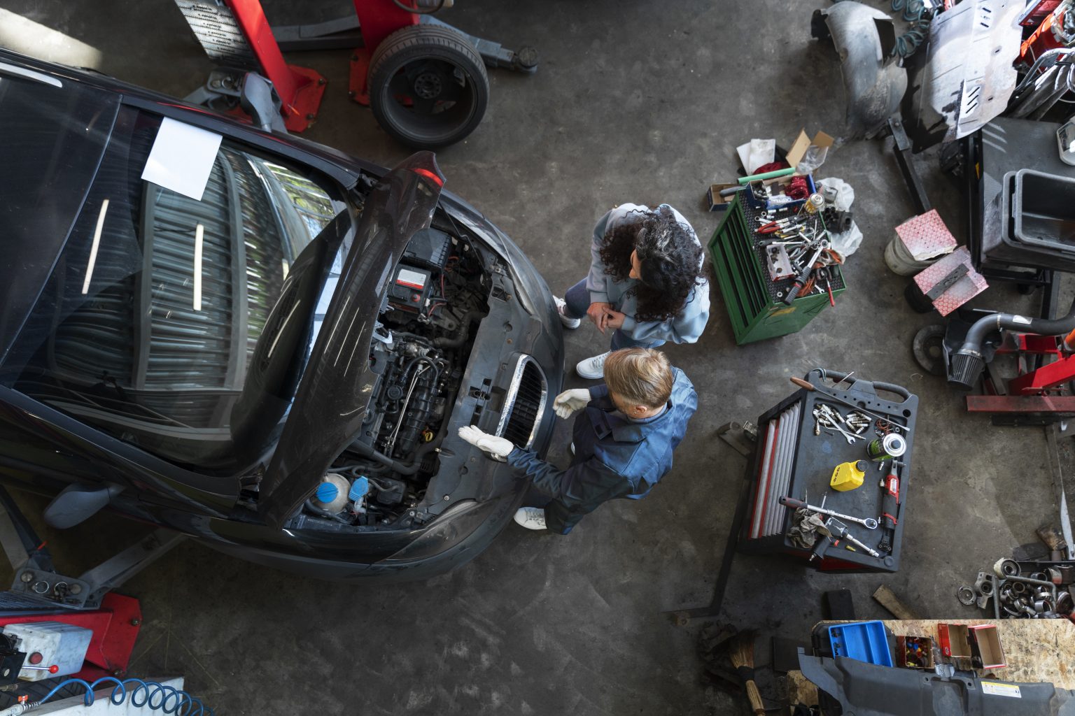 top view man repairing car